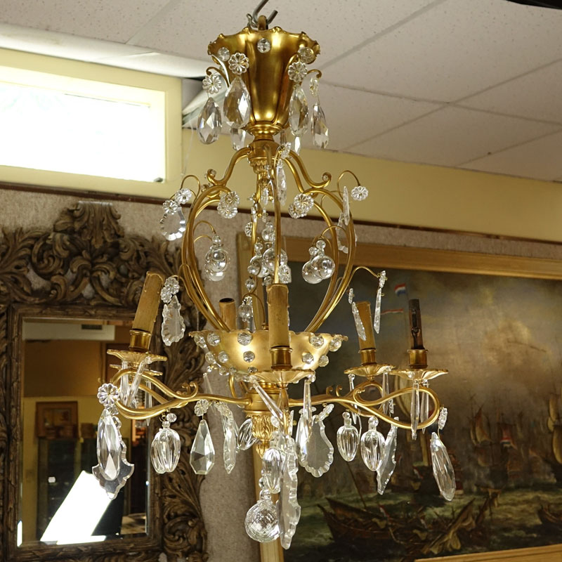 Late 19th/Early 20th Century Rococo Style Gilt Bronze and Crystal 6-Arm Chandelier. Decorated with branch form arms with various dangling crystals, beaded crystal affixed to frame, and acanthus leaves accents.