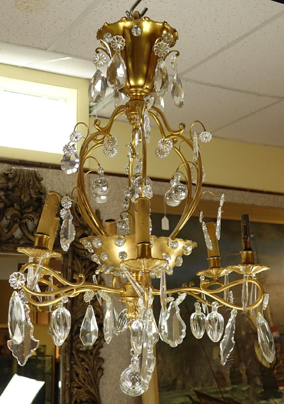 Late 19th/Early 20th Century Rococo Style Gilt Bronze and Crystal 6-Arm Chandelier. Decorated with branch form arms with various dangling crystals, beaded crystal affixed to frame, and acanthus leaves accents.