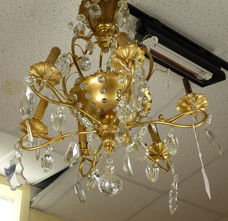 Late 19th/Early 20th Century Rococo Style Gilt Bronze and Crystal 6-Arm Chandelier. Decorated with branch form arms with various dangling crystals, beaded crystal affixed to frame, and acanthus leaves accents.