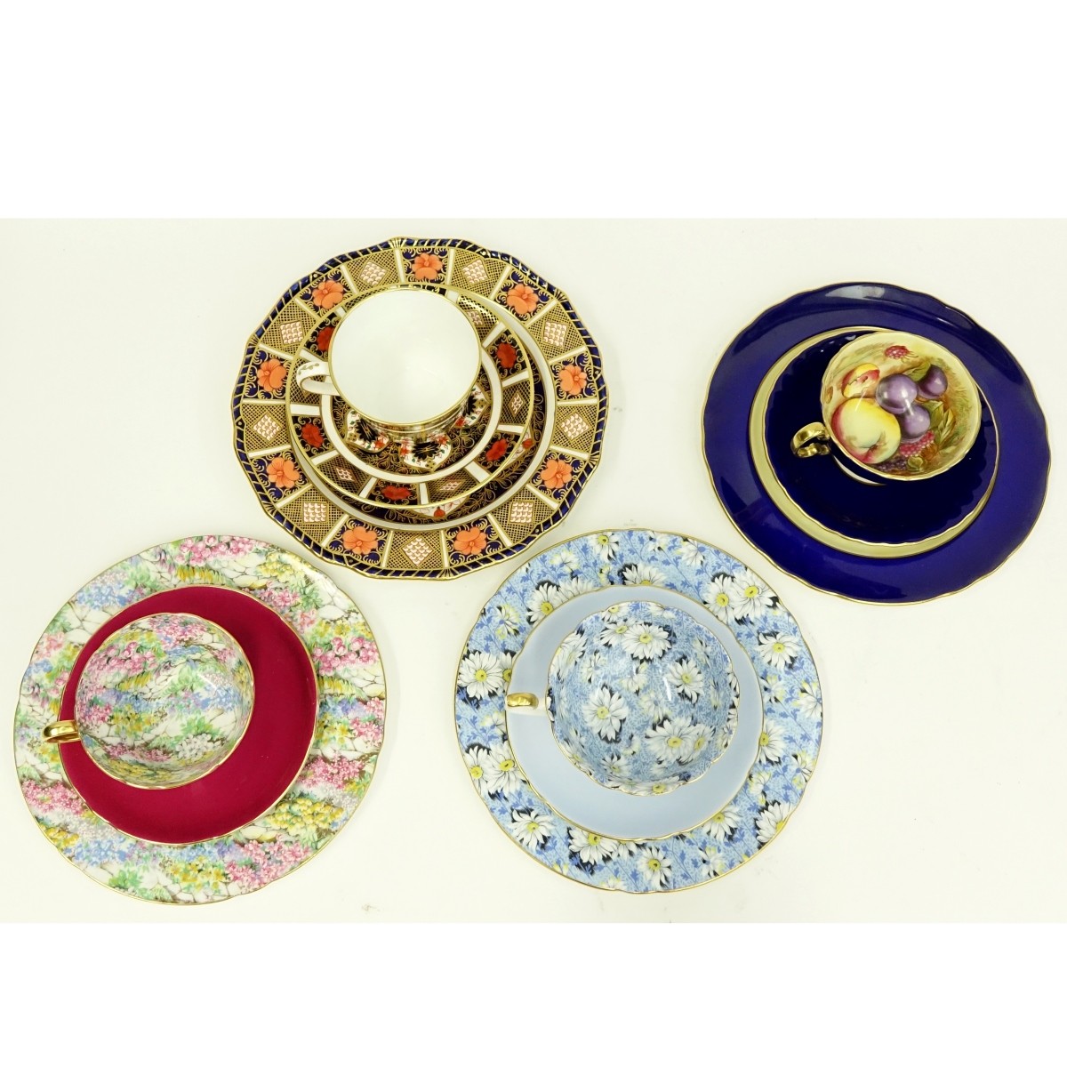 Four English Porcelain 3 Piece Cup And Saucer Sets