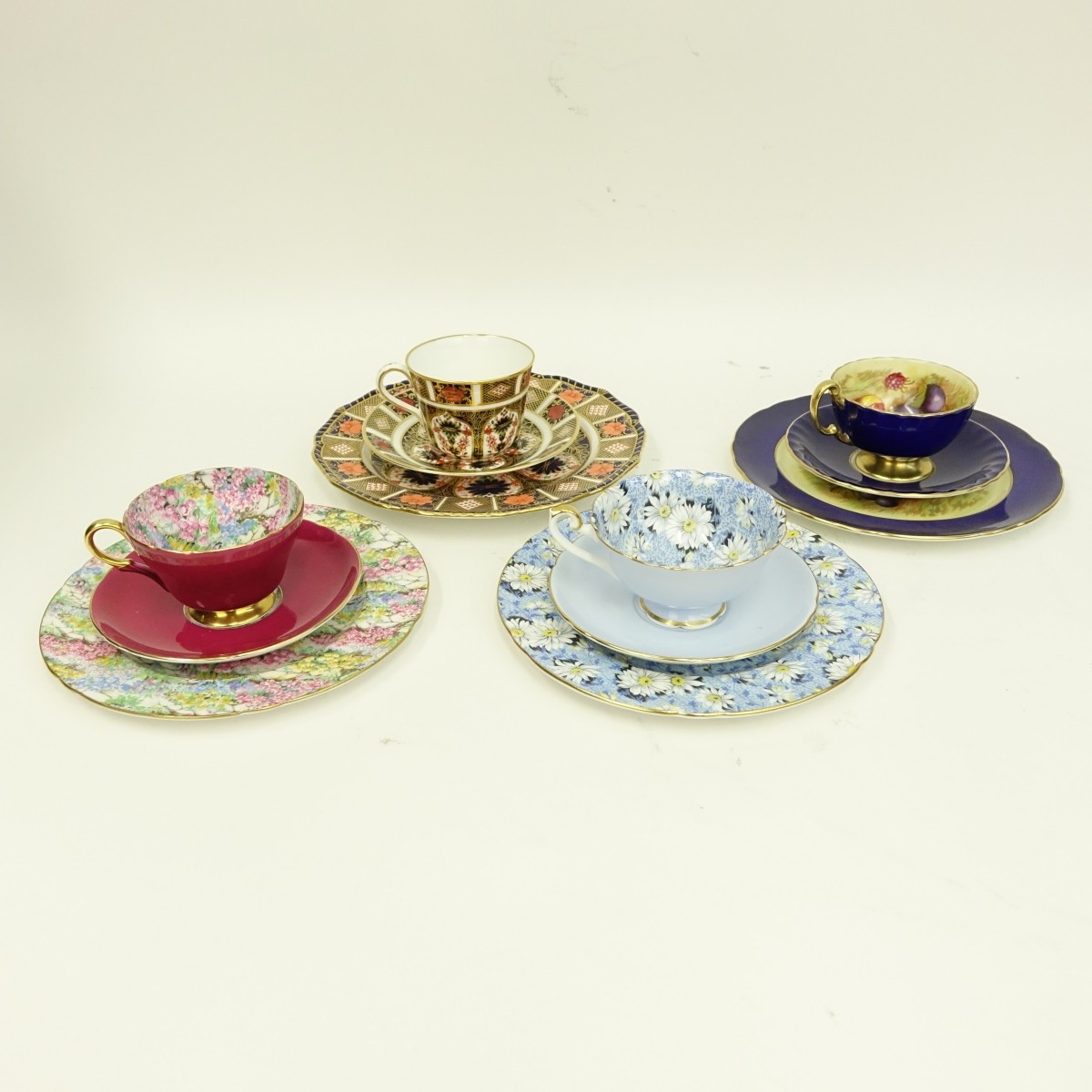 Four English Porcelain 3 Piece Cup And Saucer Sets