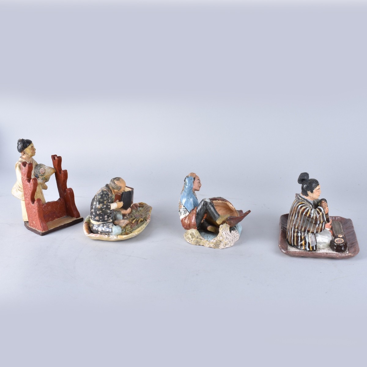 Four Japanese Pottery Figures