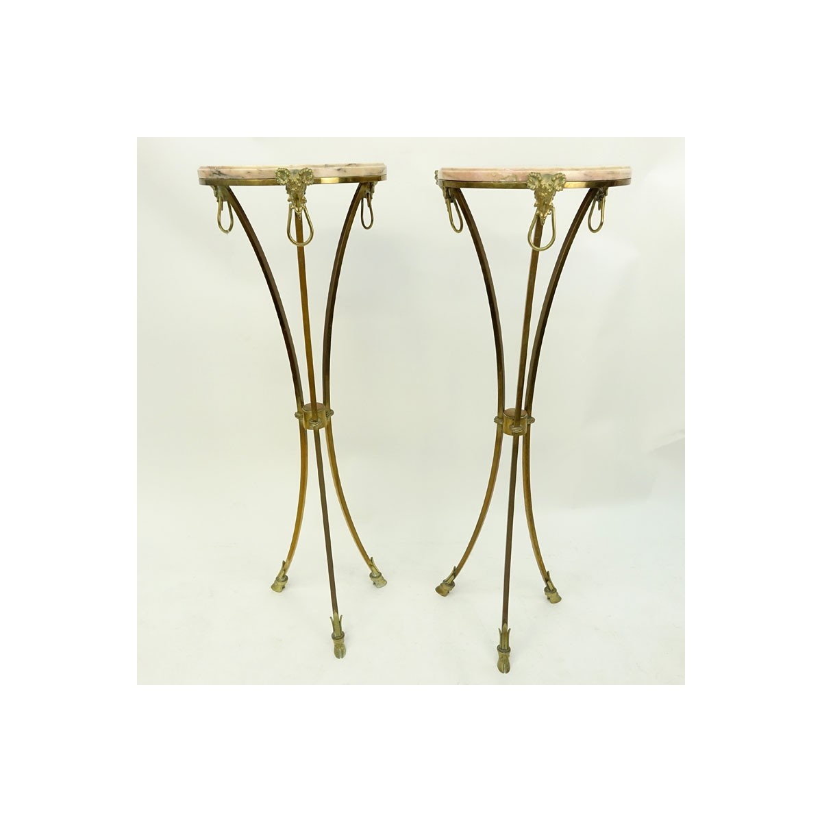 Pair of Marble Top Maison Jansen Style Brass Pedestal Tables. Rams head fittings standing on hoof f