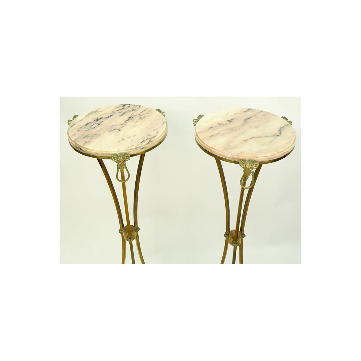Pair of Marble Top Maison Jansen Style Brass Pedestal Tables. Rams head fittings standing on hoof f