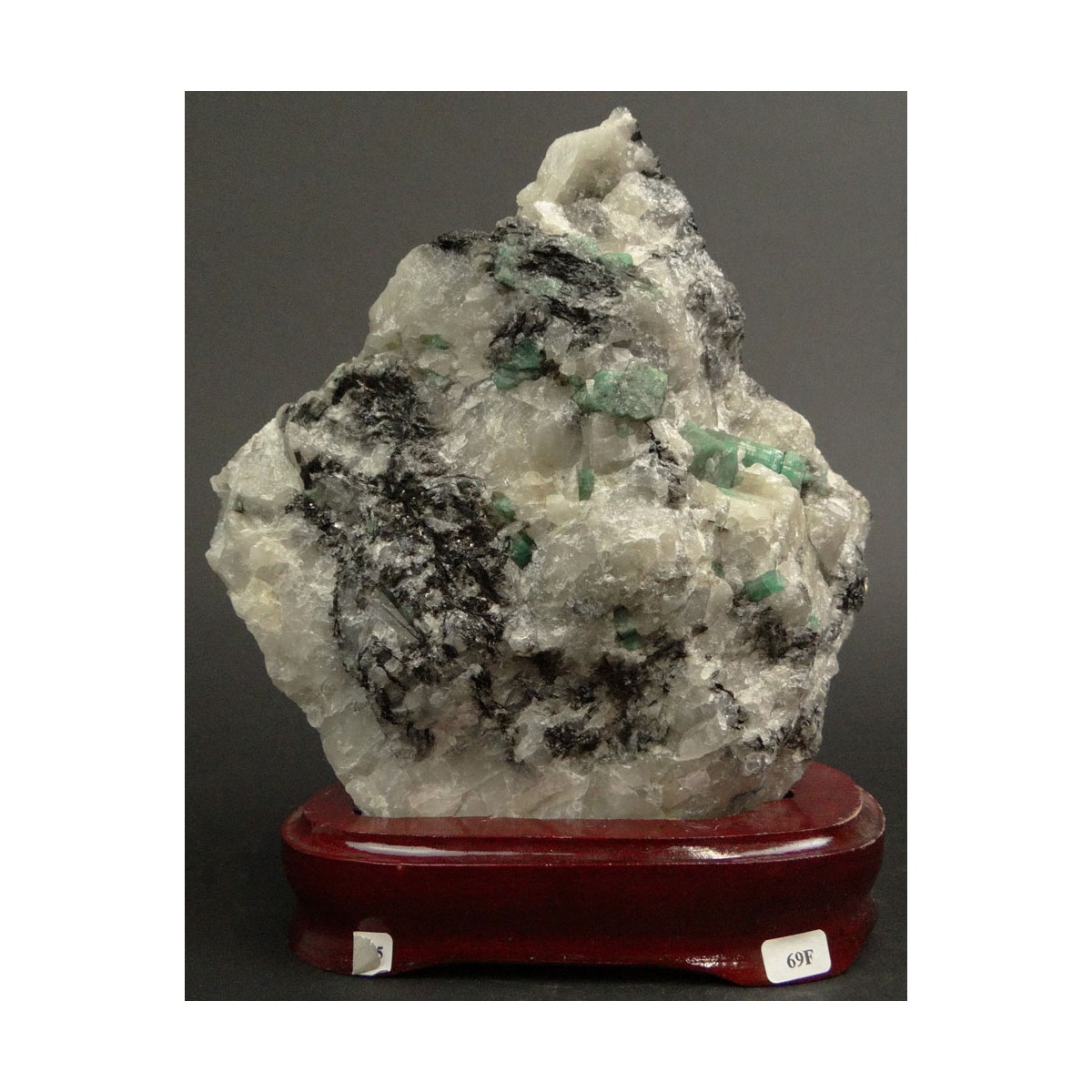 Mineral Specimen with Emeralds Mounted on Wooden Base. Measures 6-7/8 Inches by 6-1/2 Inches. Measu