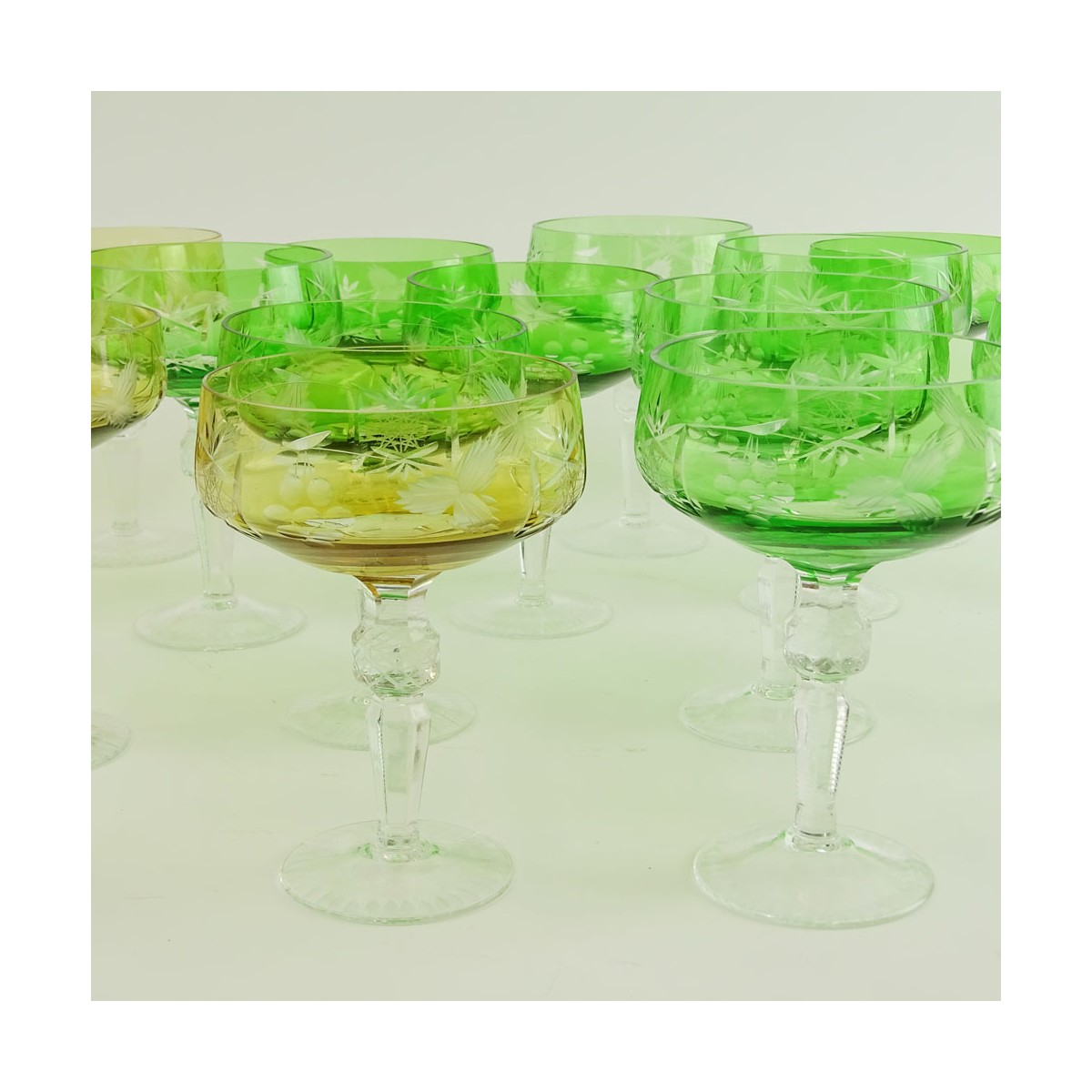 Lot of 17 Bohemian Cut Glass Champagne Coupes in Green (12) and Amber (5). Measure 5-5/8". Very goo