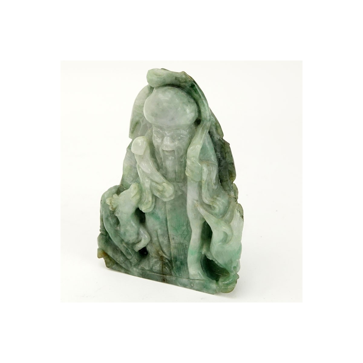 Chinese Carved Jade Shou Lao Figurine. Depicted holding staff and scepter. Light to dark green in c