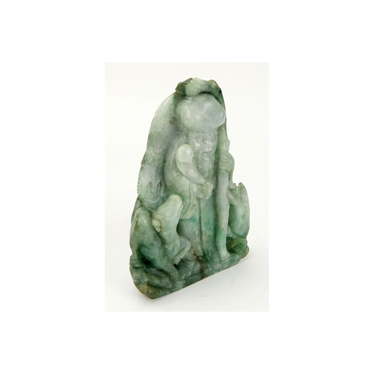 Chinese Carved Jade Shou Lao Figurine. Depicted holding staff and scepter. Light to dark green in c