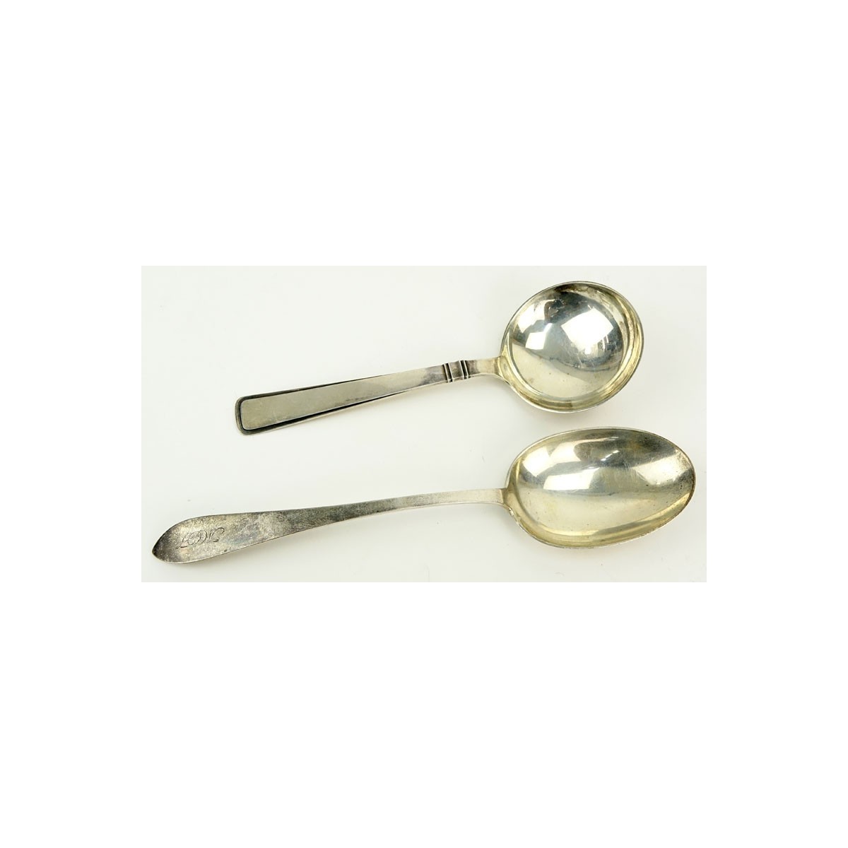 Grouping of Two (2) Sterling Silver Serving Spoons. Includes: Tiffany & Co. "Faneuil" vegetable ser