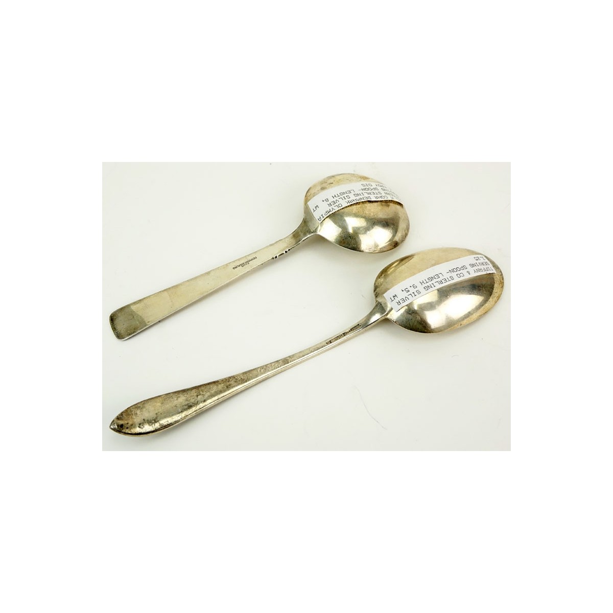 Grouping of Two (2) Sterling Silver Serving Spoons. Includes: Tiffany & Co. "Faneuil" vegetable ser