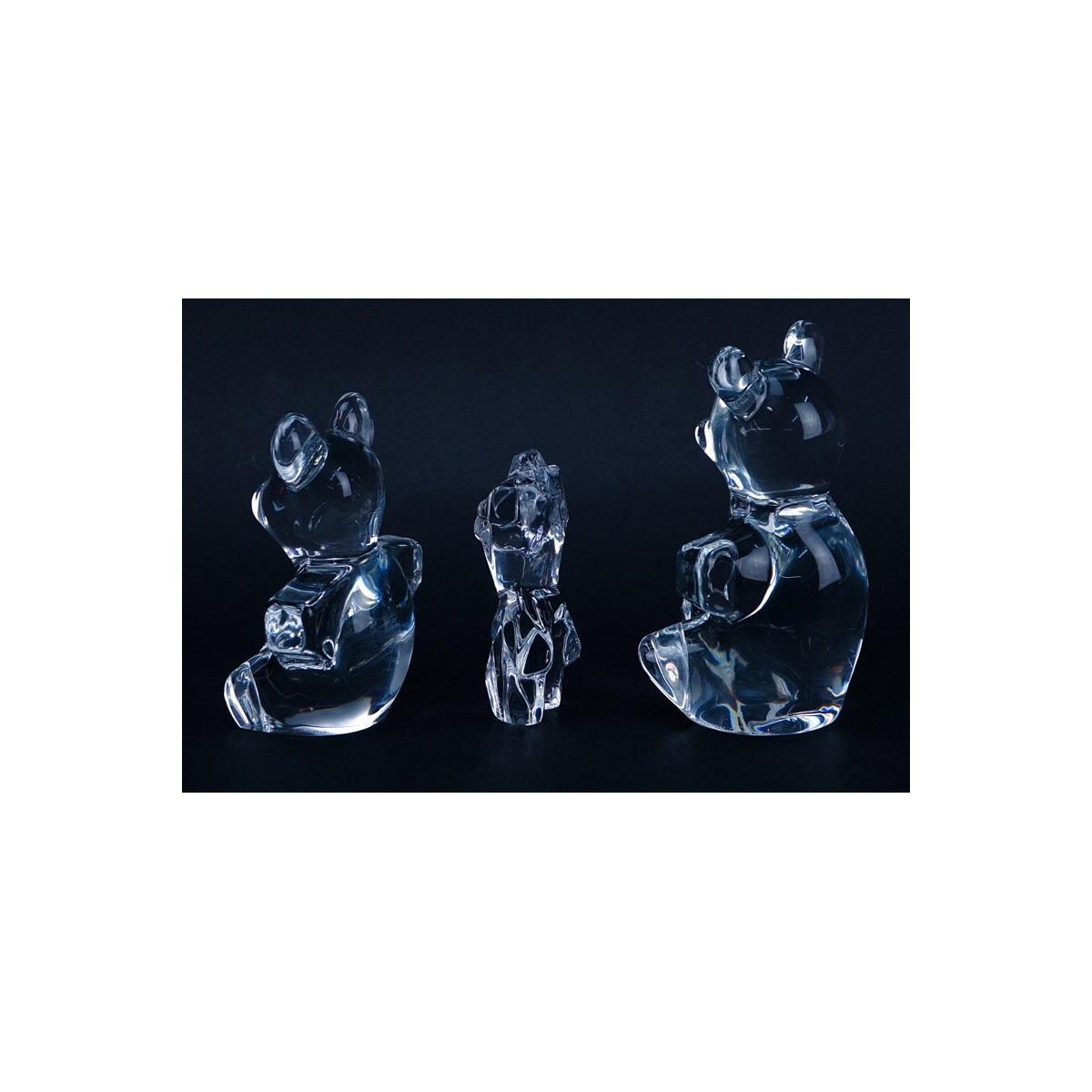 Two (2) Daum Crystal Bear Figurines and a Daum Nude Torso Figure. Signed. Good condition. Larger be