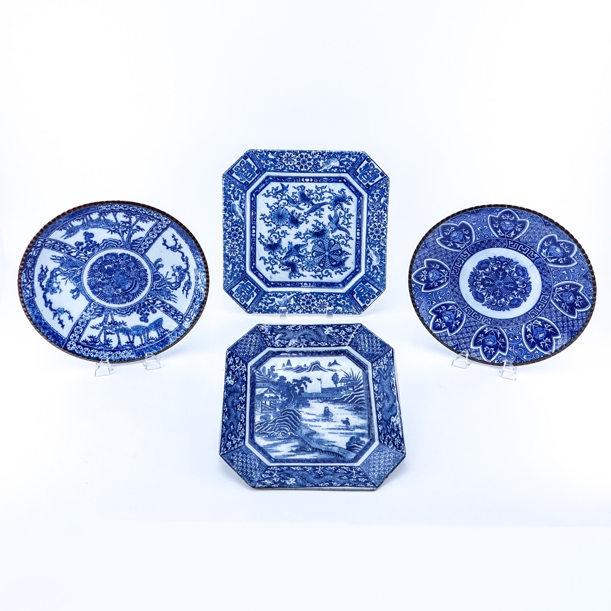 Four (4) Chinese Blue & White Pottery Chargers. Unsigned. Good condition. Largest measures 12" x 12