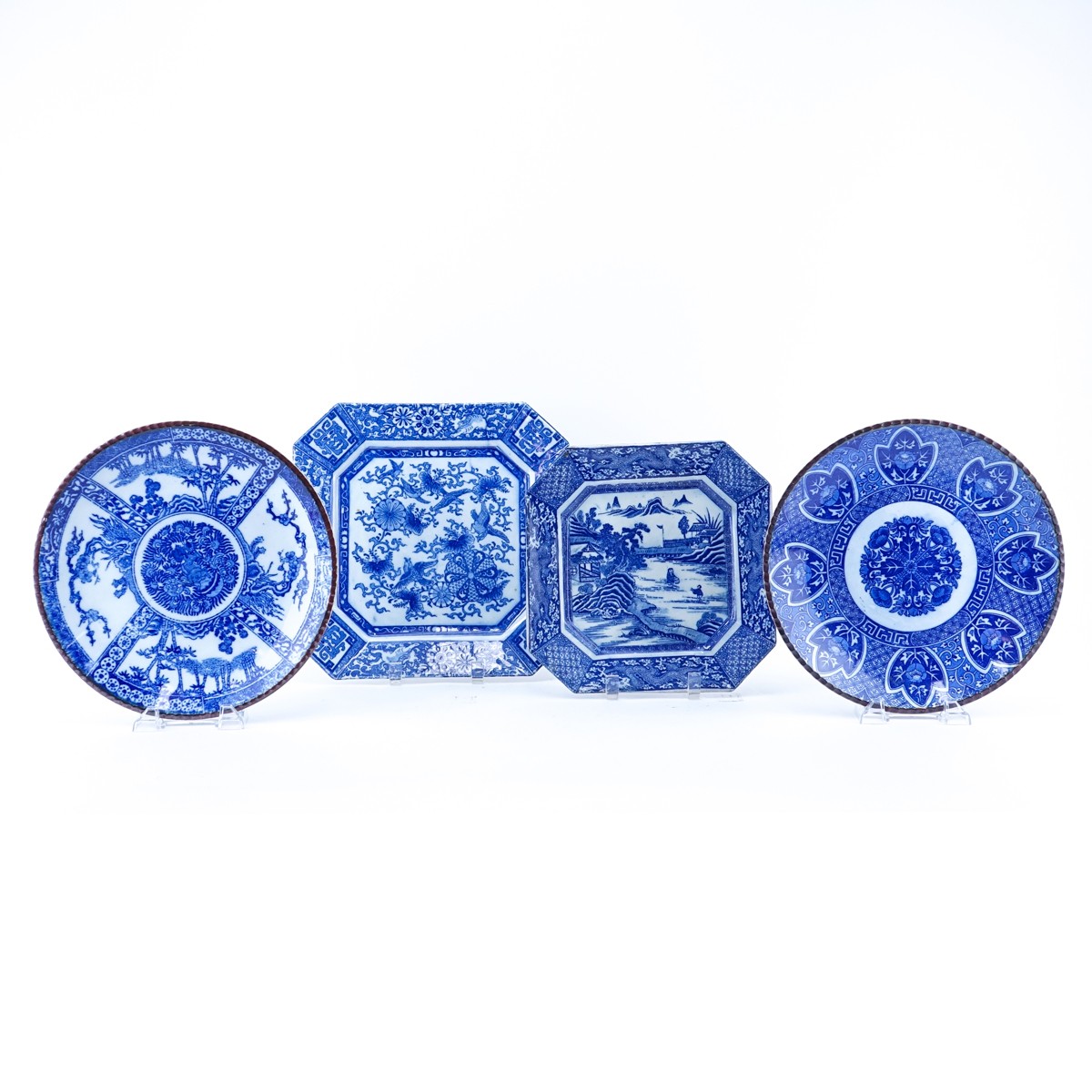 Four (4) Chinese Blue & White Pottery Chargers. Unsigned. Good condition. Largest measures 12" x 12