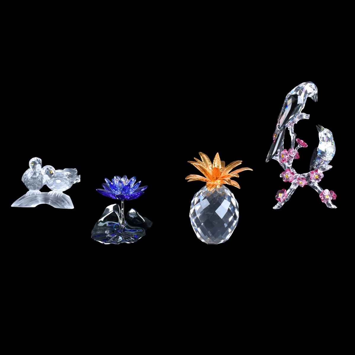 Four Swarovski Figurines.