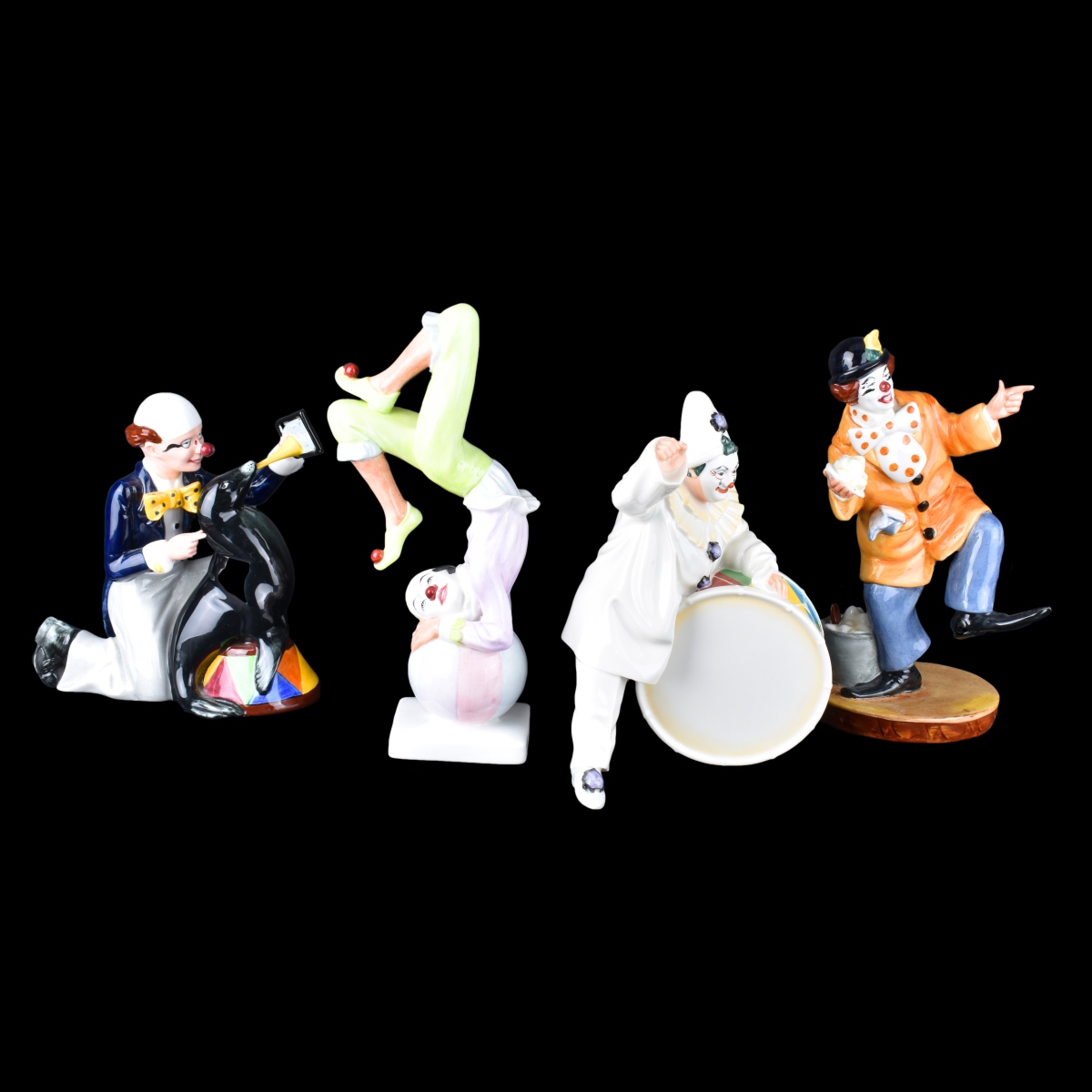 Four Porcelain Figurines