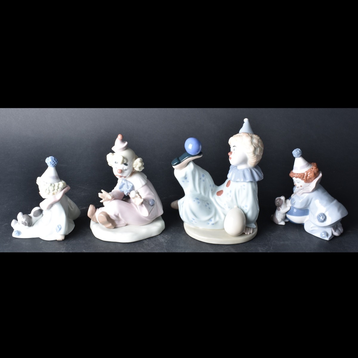 Four Porcelain Figurines