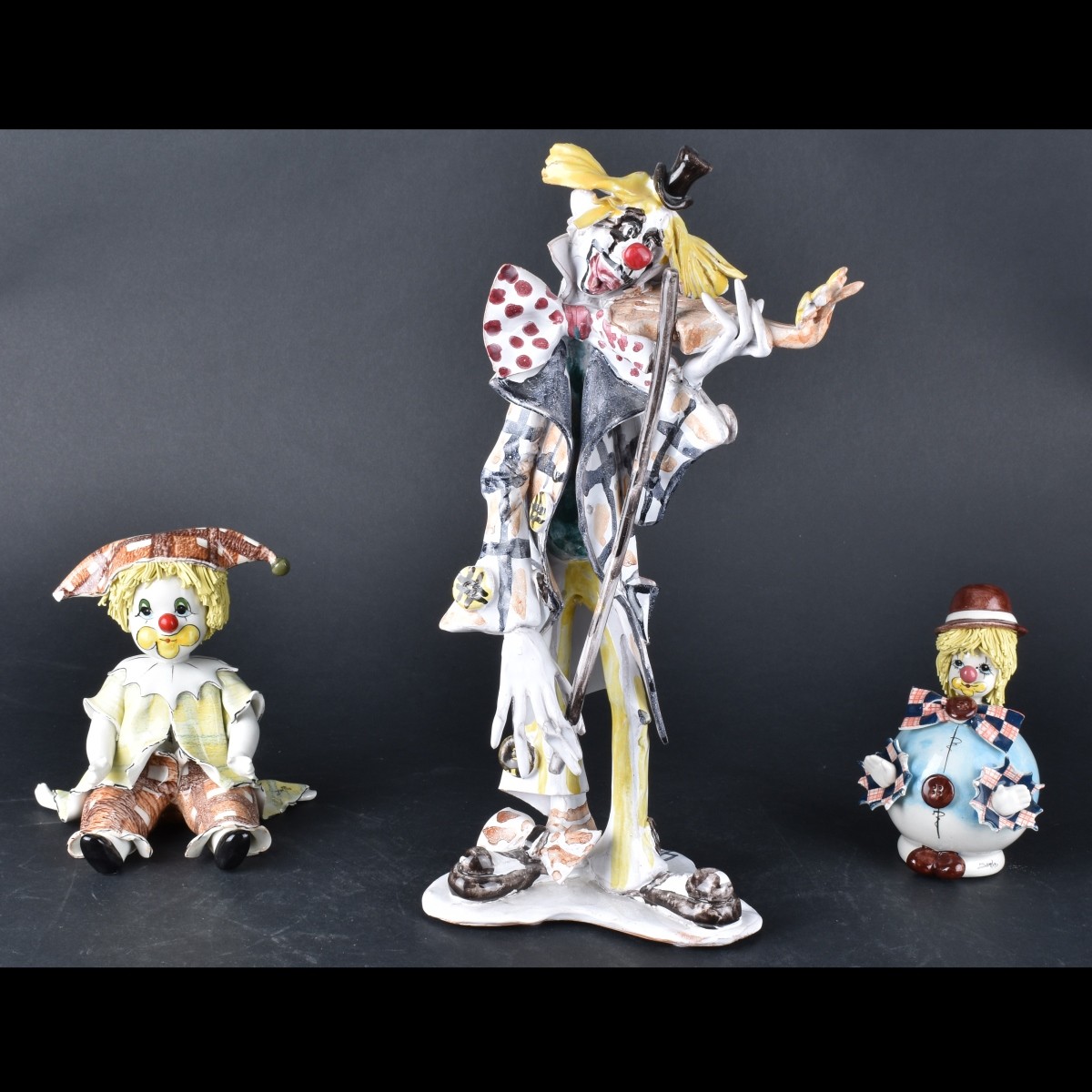 Three Clown Figurines