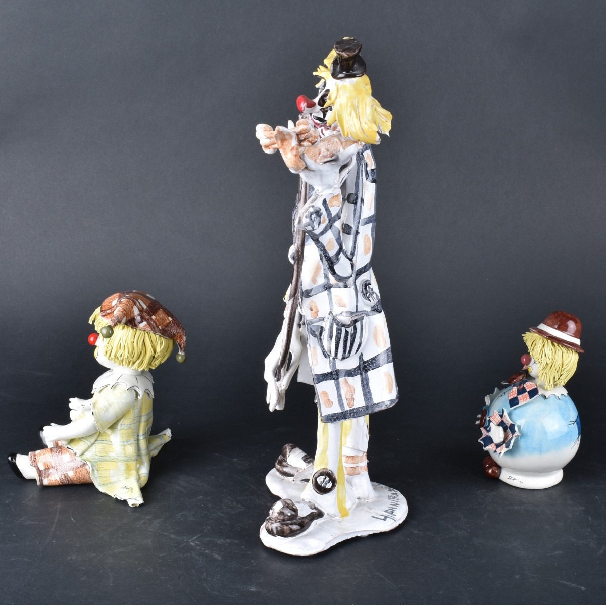 Three Clown Figurines