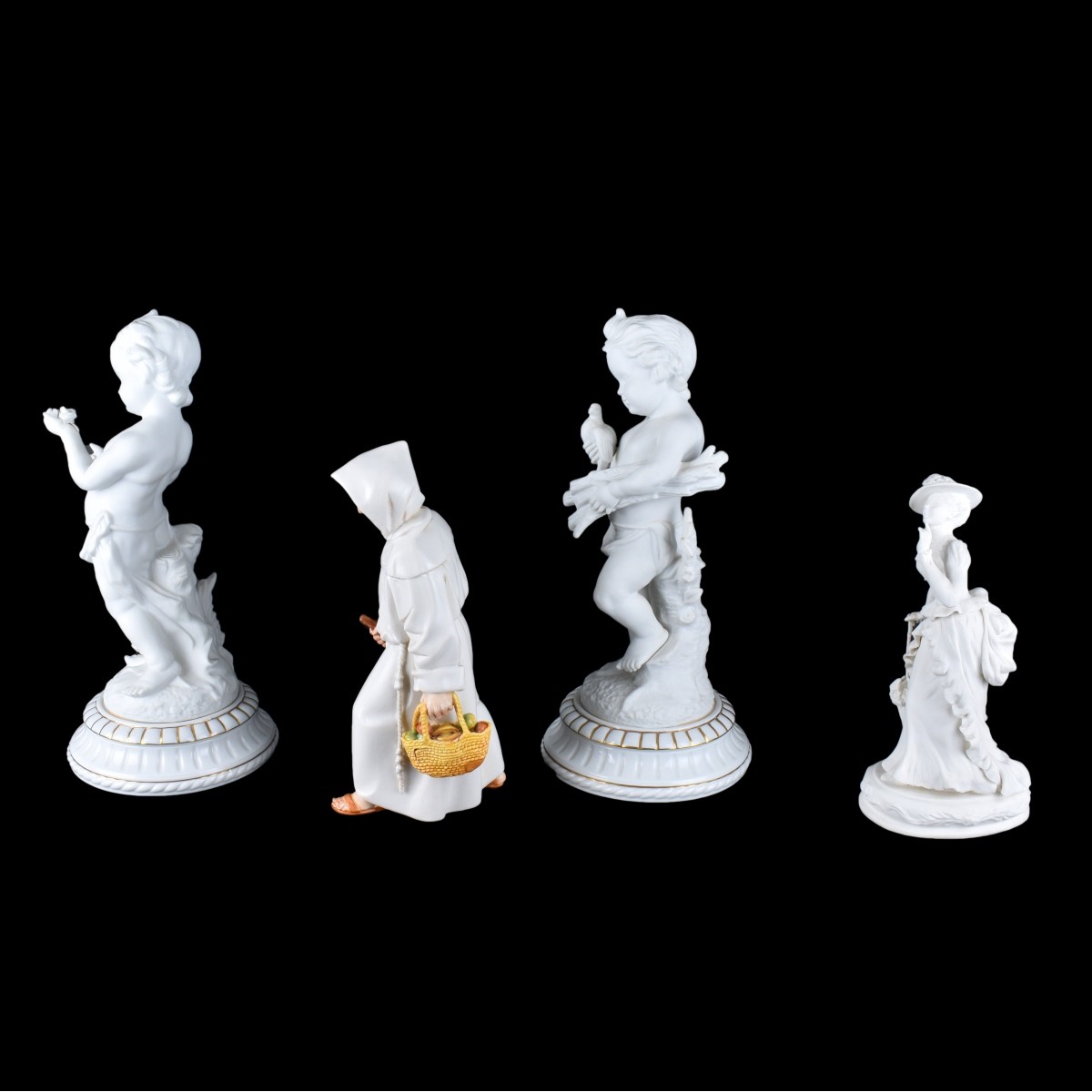 Four Bisque Figurines