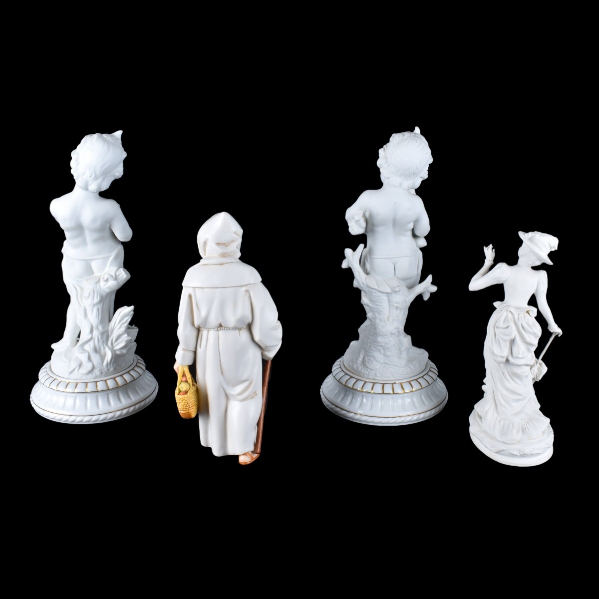Four Bisque Figurines