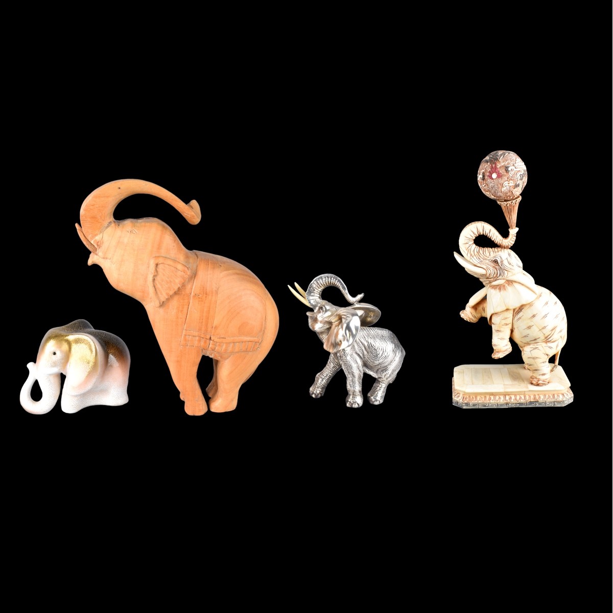 Four Elephant Figurines