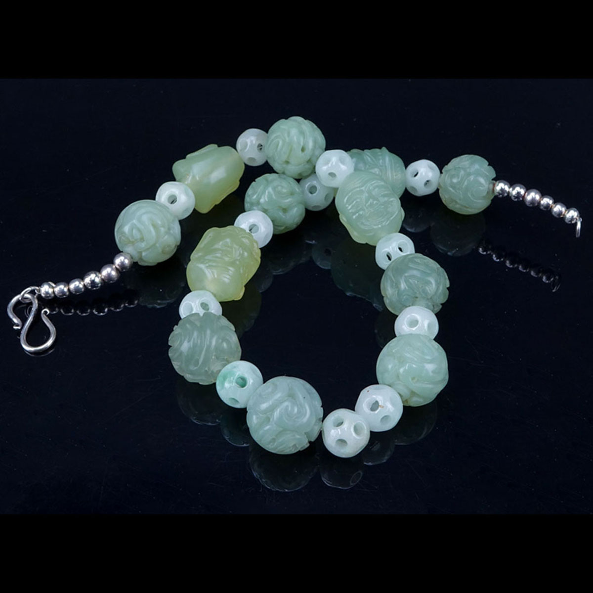 Collection of Two (2) 19/20th Century Chinese Jade Jewelry Items.