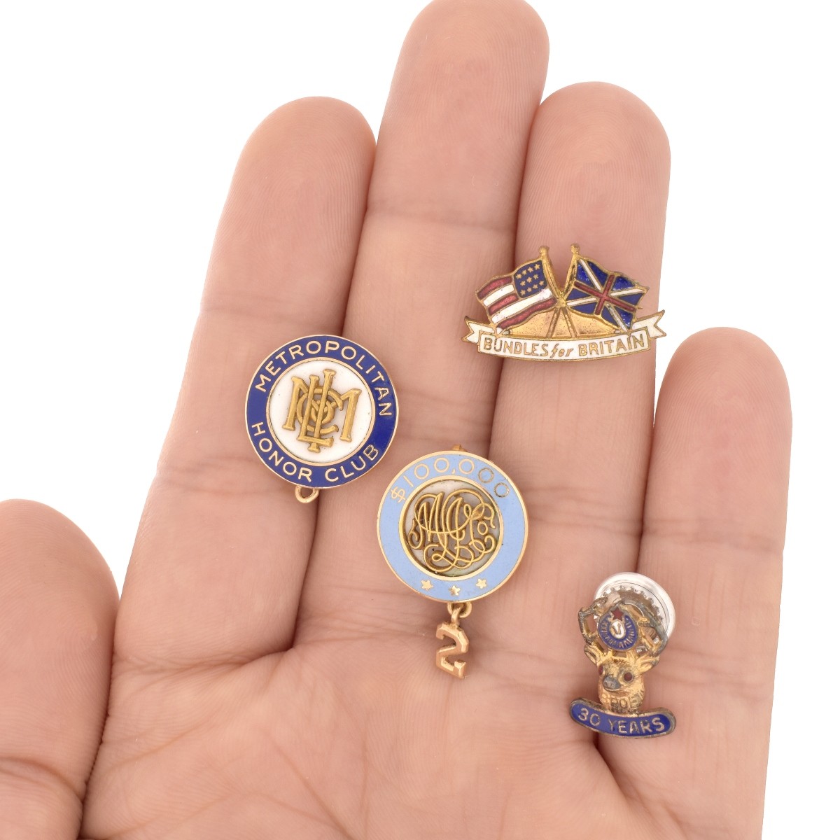 Collection of Four Enamel Pins