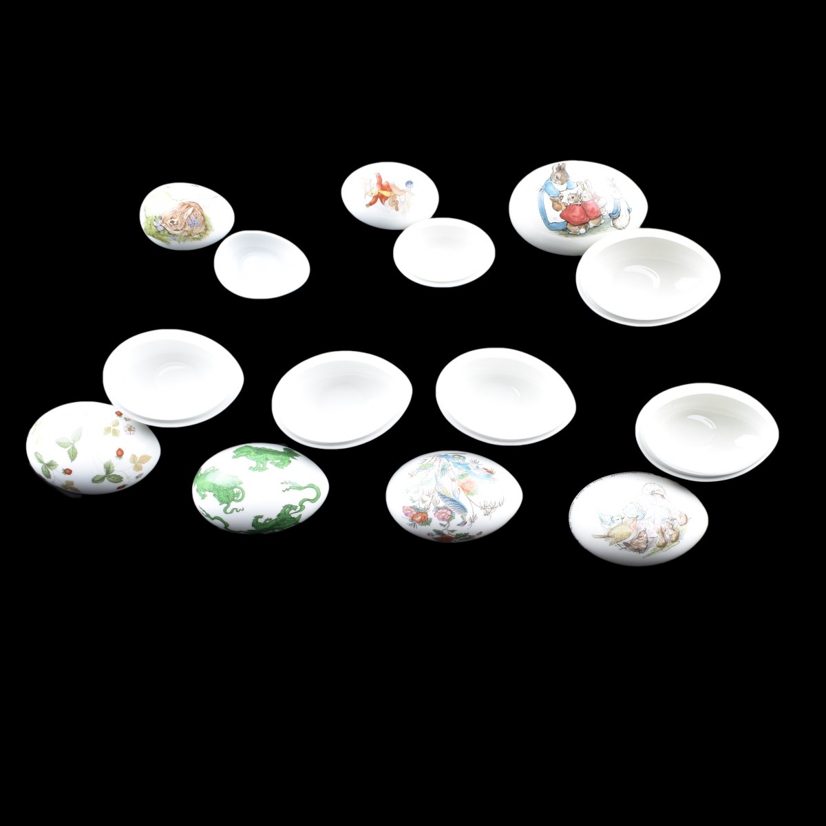 Seven Assorted Glazed Porcelain Egg Boxes