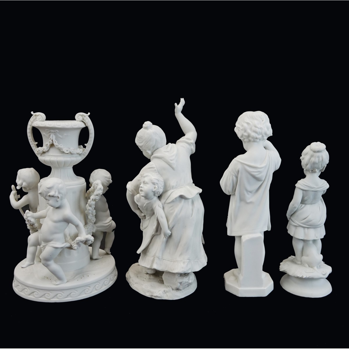 Four (4) Vintage Bisque Figurines