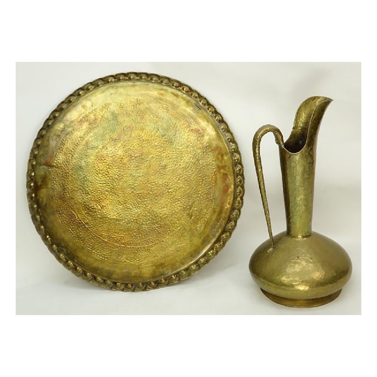 Grouping of a Large Brass Charger and Ewer