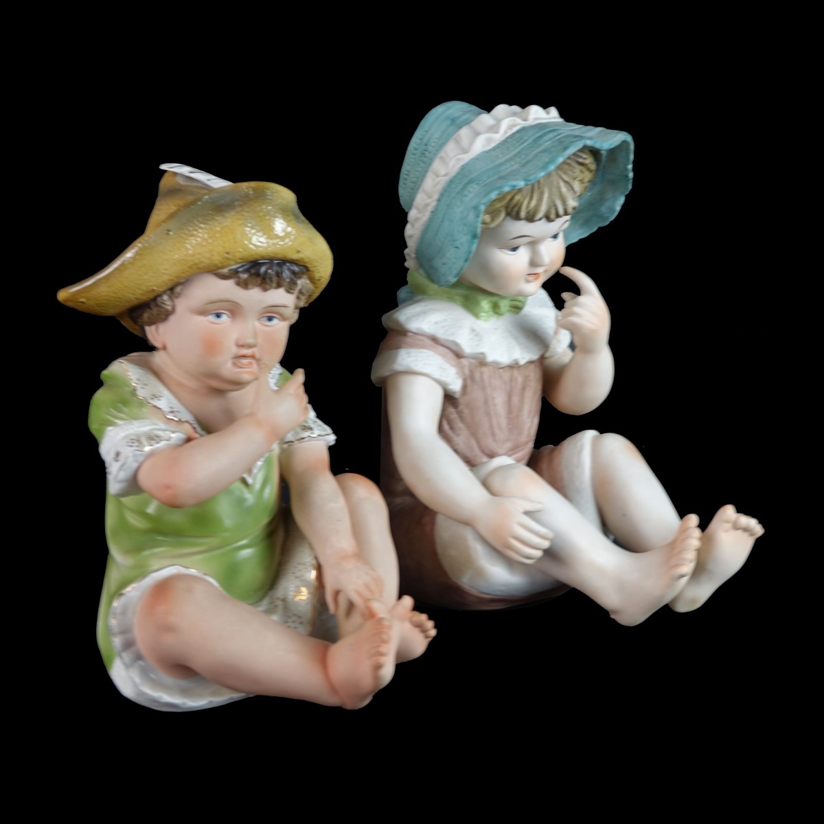 Two (2) Bisque Porcelain Seated Babies