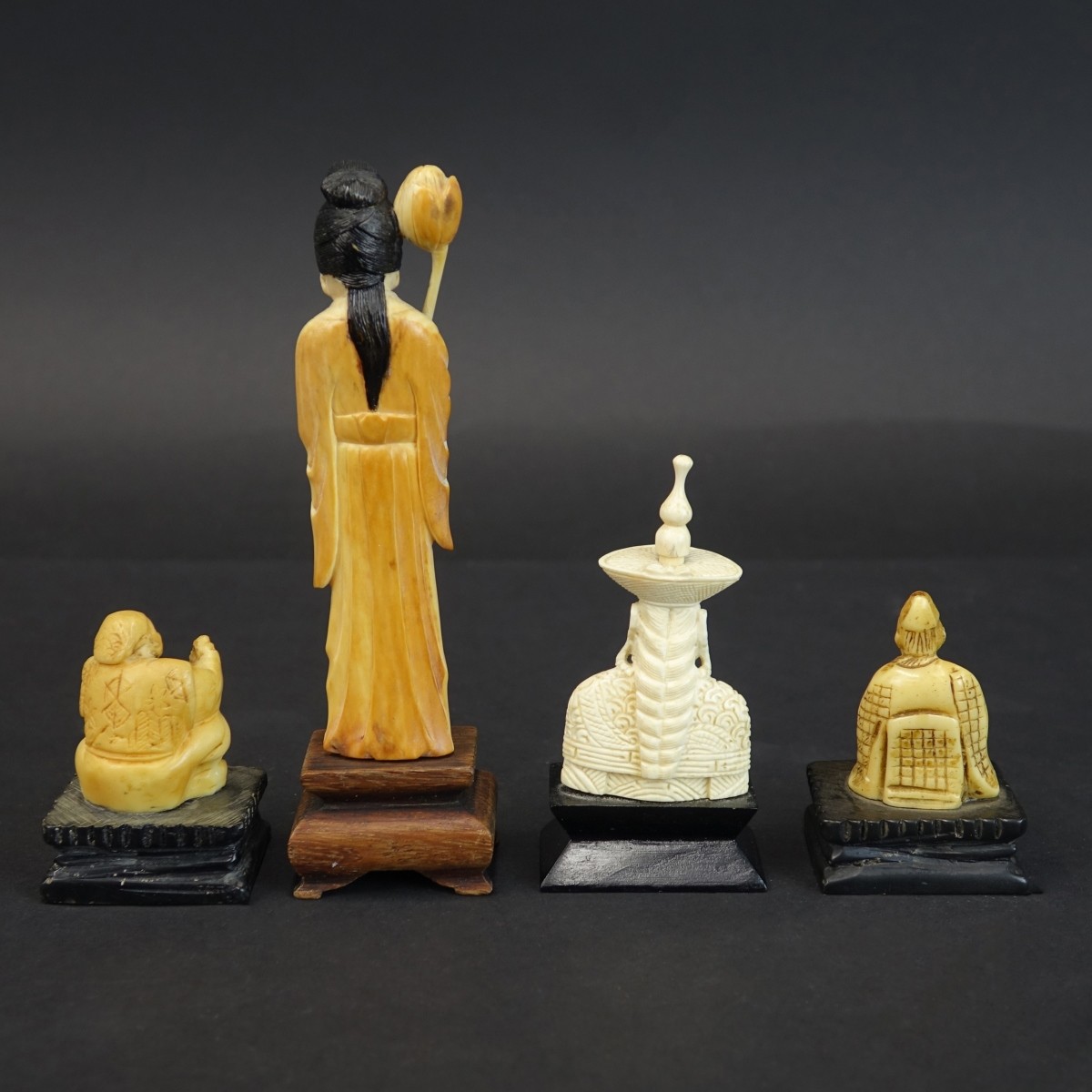 Four (4) Oriental Carved Figurines