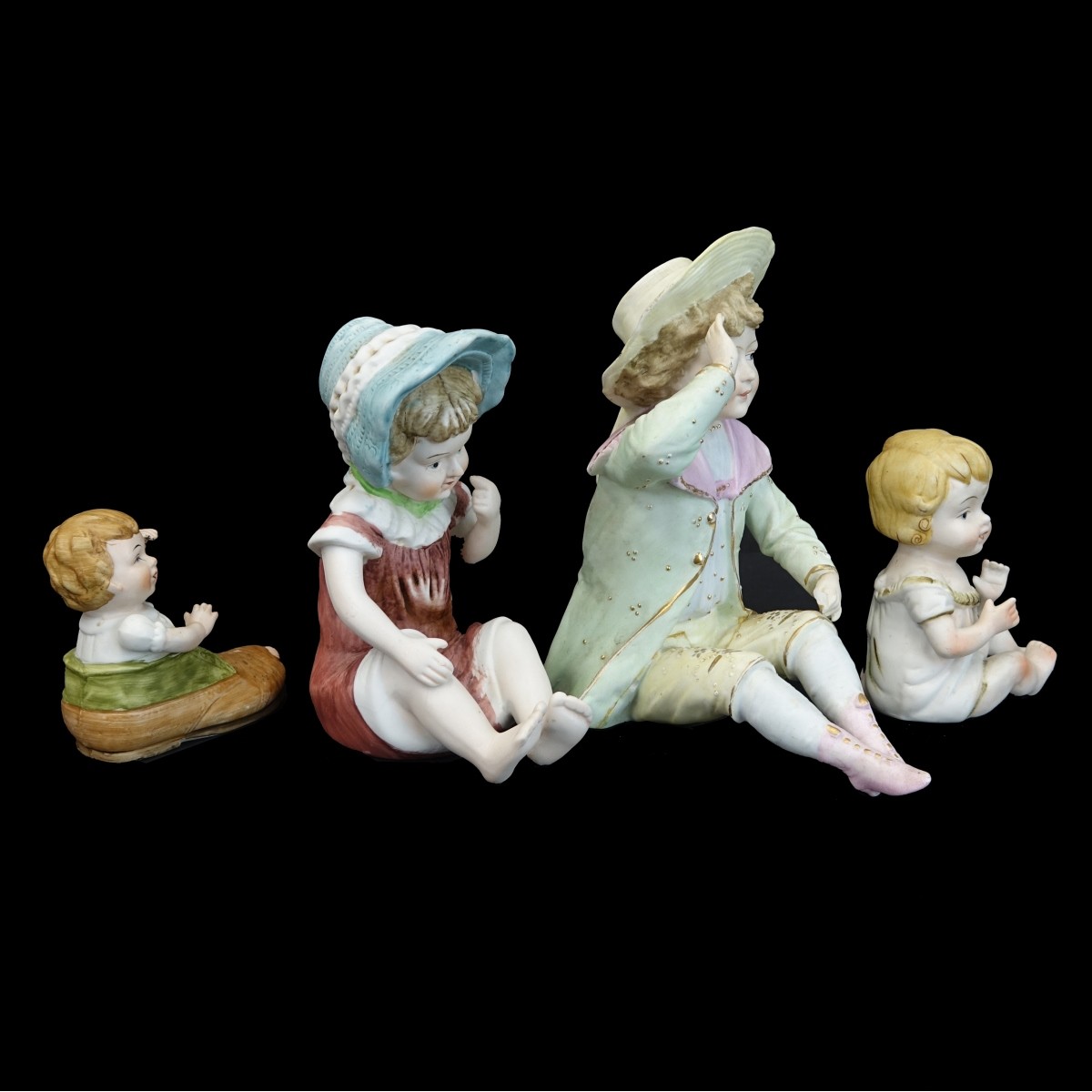 Four (4) Vintage Bisque Figurines