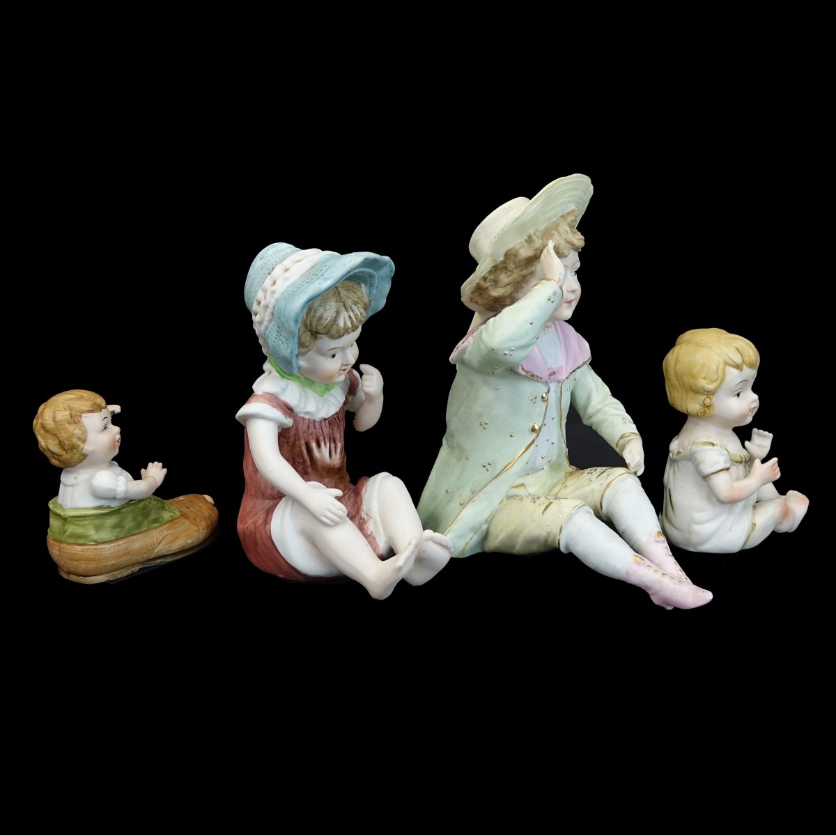 Four (4) Vintage Bisque Figurines