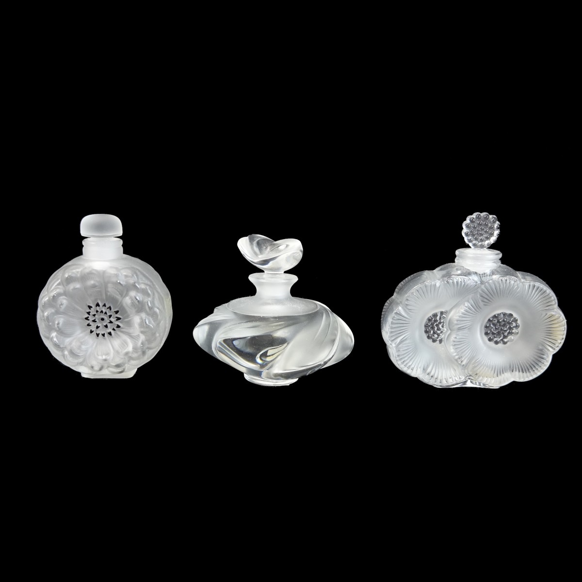 Three Lalique Crystal Perfume Bottles