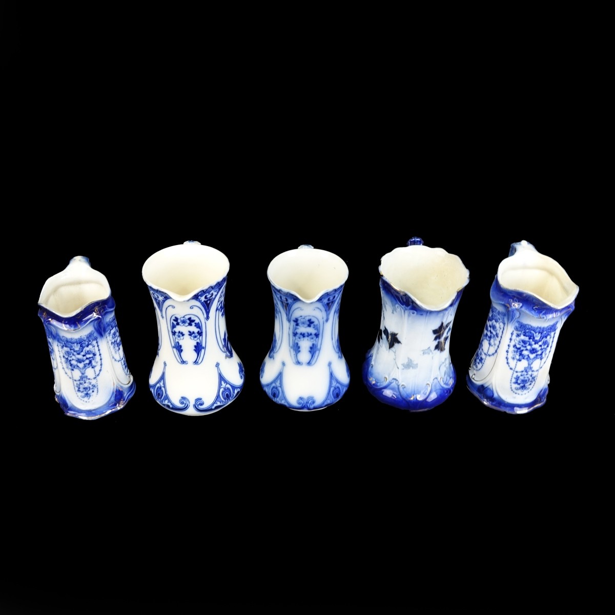 Five (5) Antique Flow Blue Porcelain Pitchers