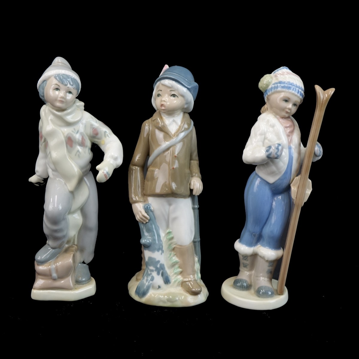 Three (3) Casades Glazed Porcelain Figurines