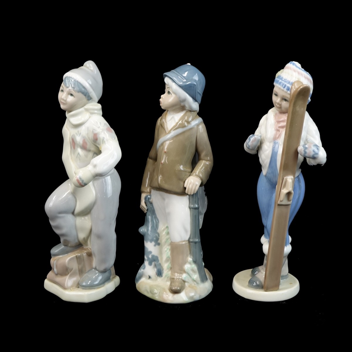 Three (3) Casades Glazed Porcelain Figurines