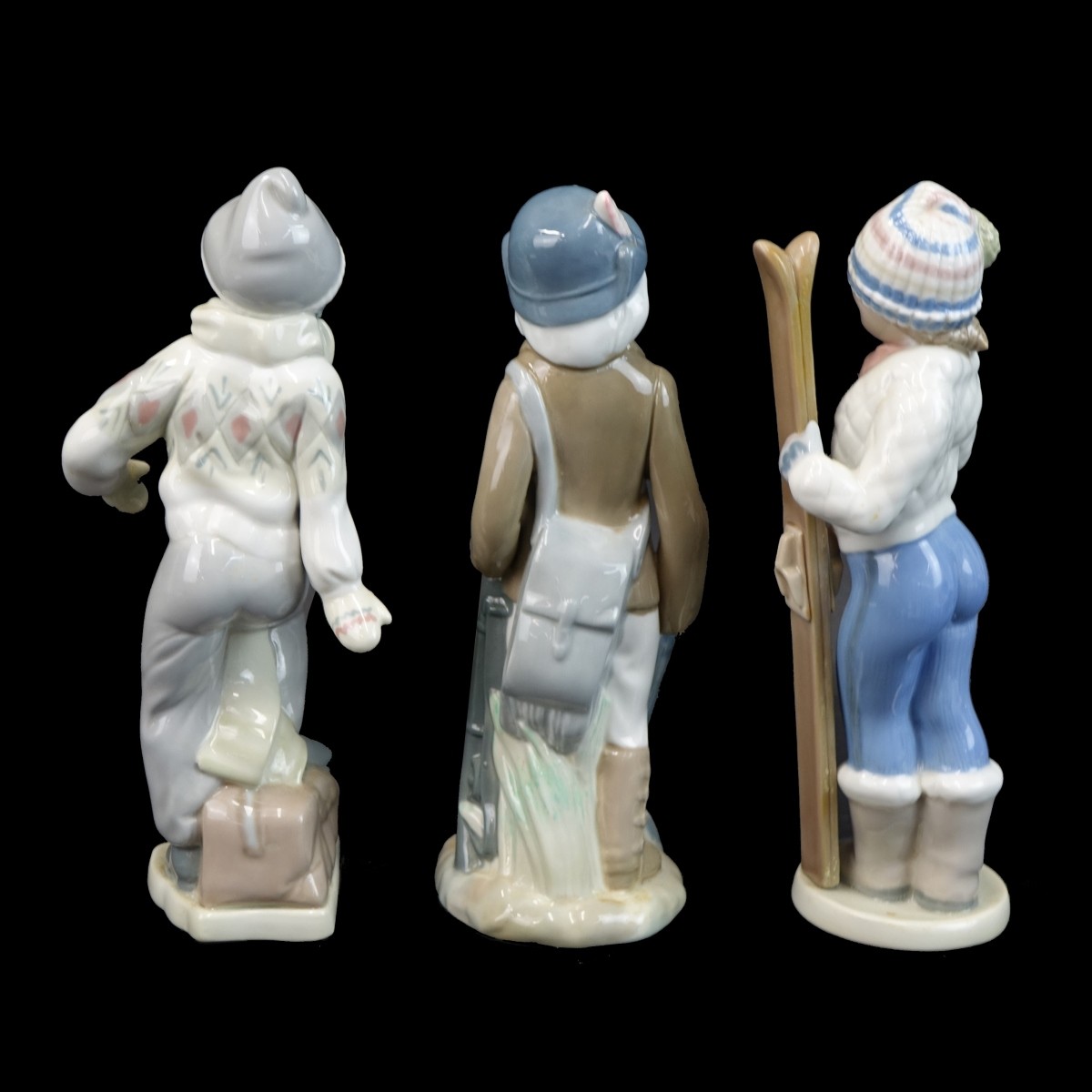 Three (3) Casades Glazed Porcelain Figurines