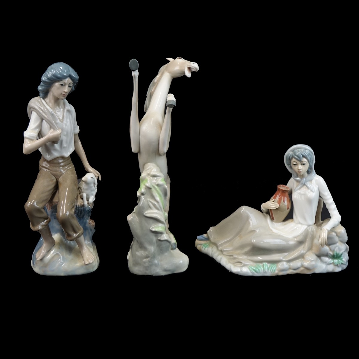 Three (3) Casades Glazed Porcelain Figurines