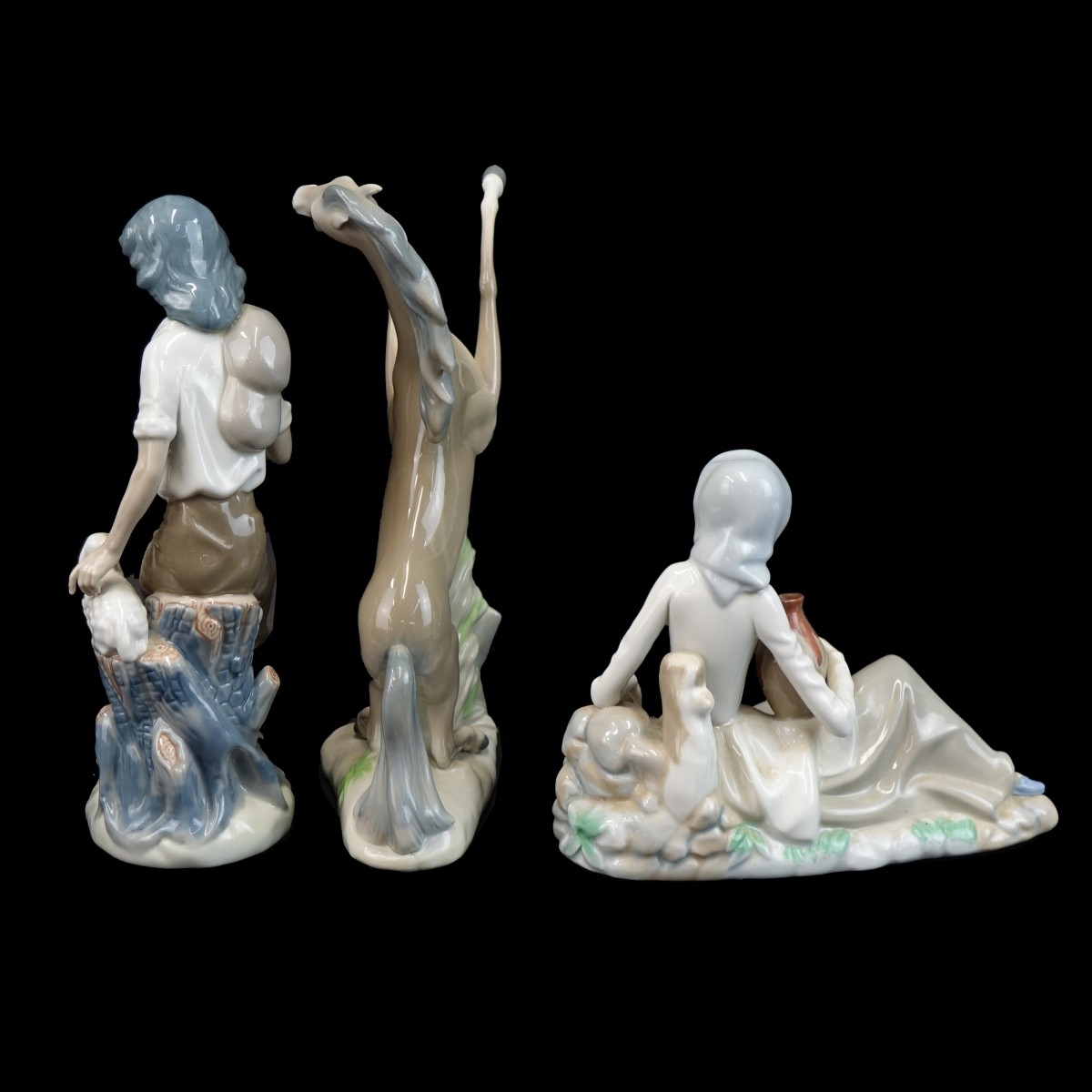 Three (3) Casades Glazed Porcelain Figurines