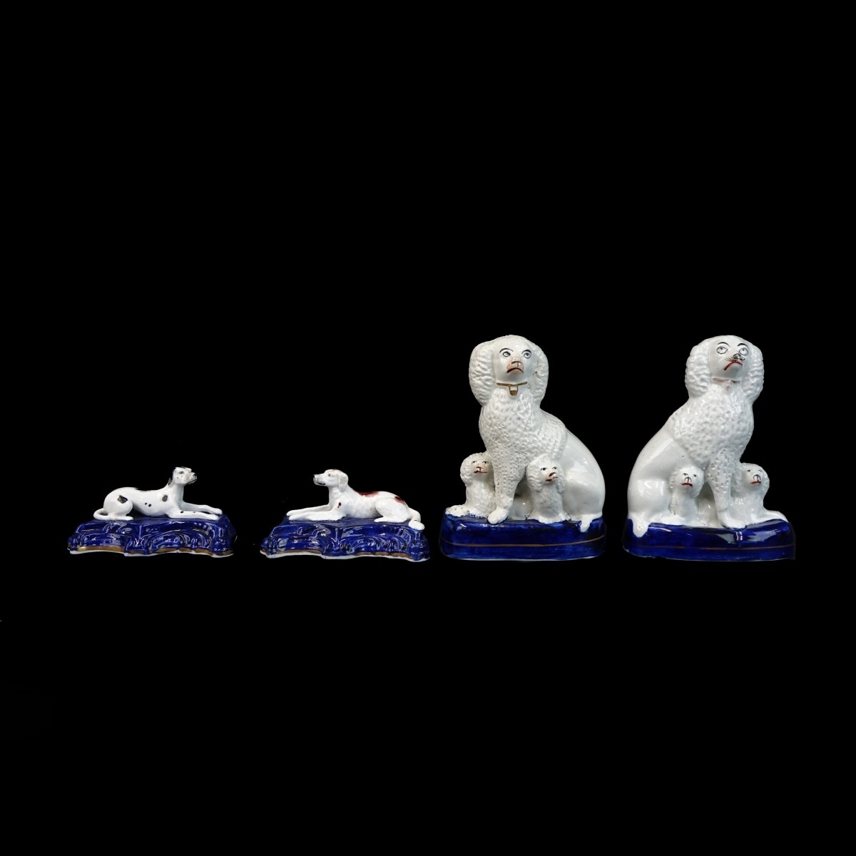 Four (4) Antique Staffordshire Dog Figurines