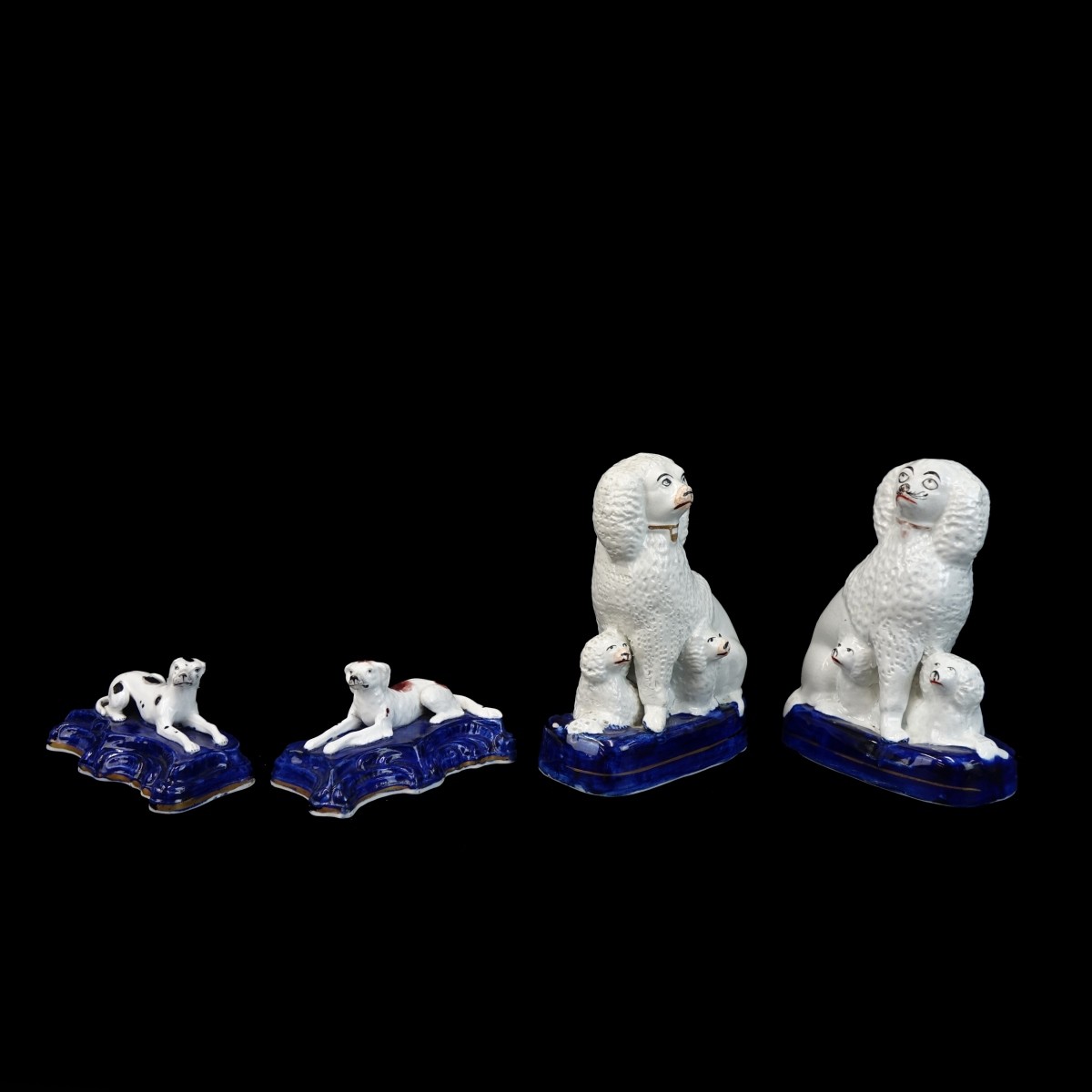 Four (4) Antique Staffordshire Dog Figurines