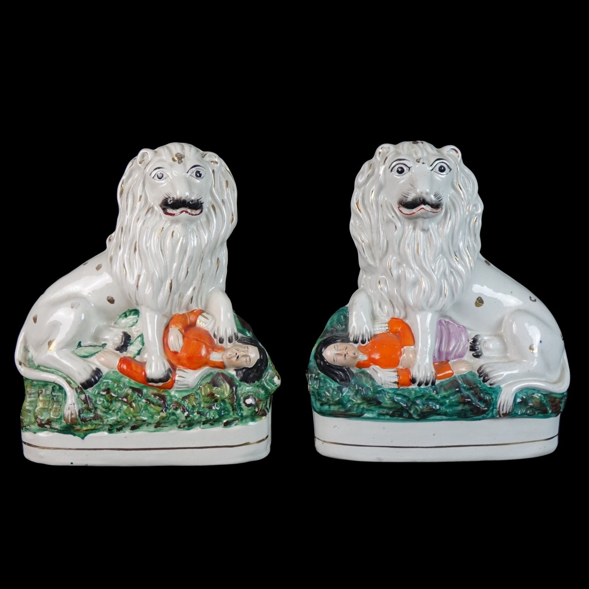 Pair of Staffordshire Lion and Napoleon Figures