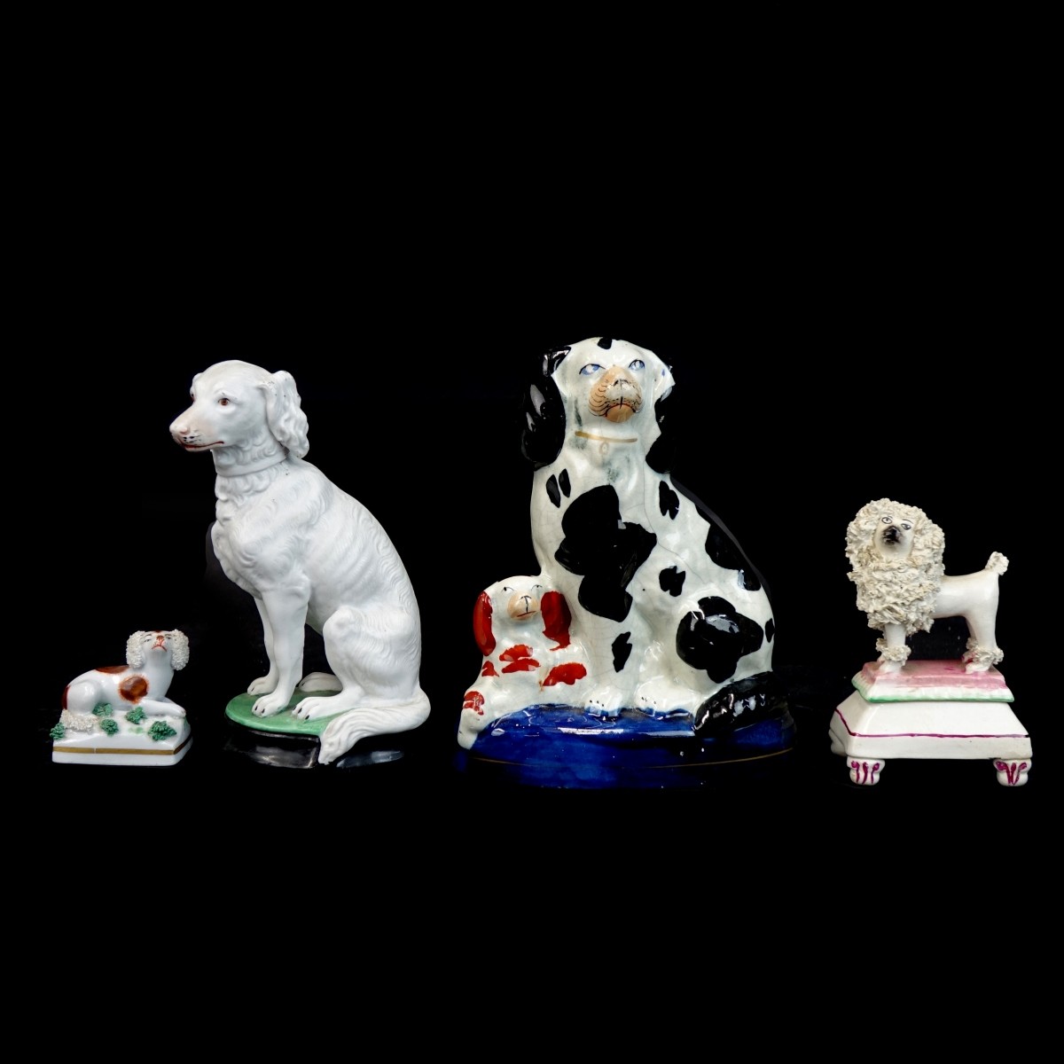 Four (4) Porcelain Dog Figurines