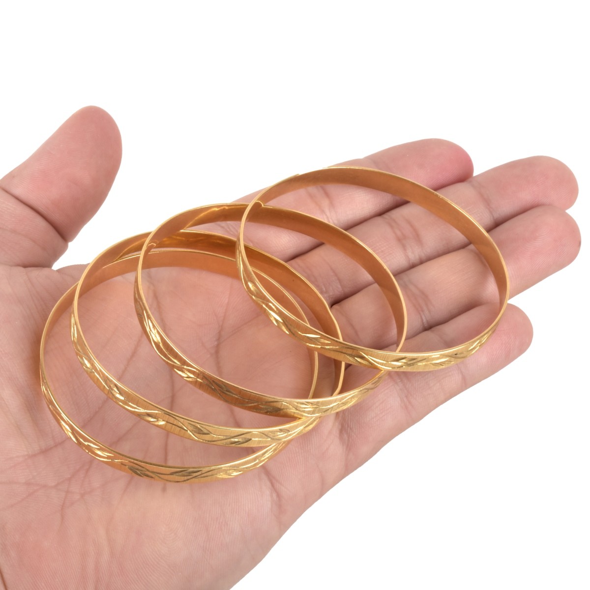 Four 18K Bangle Bracelets