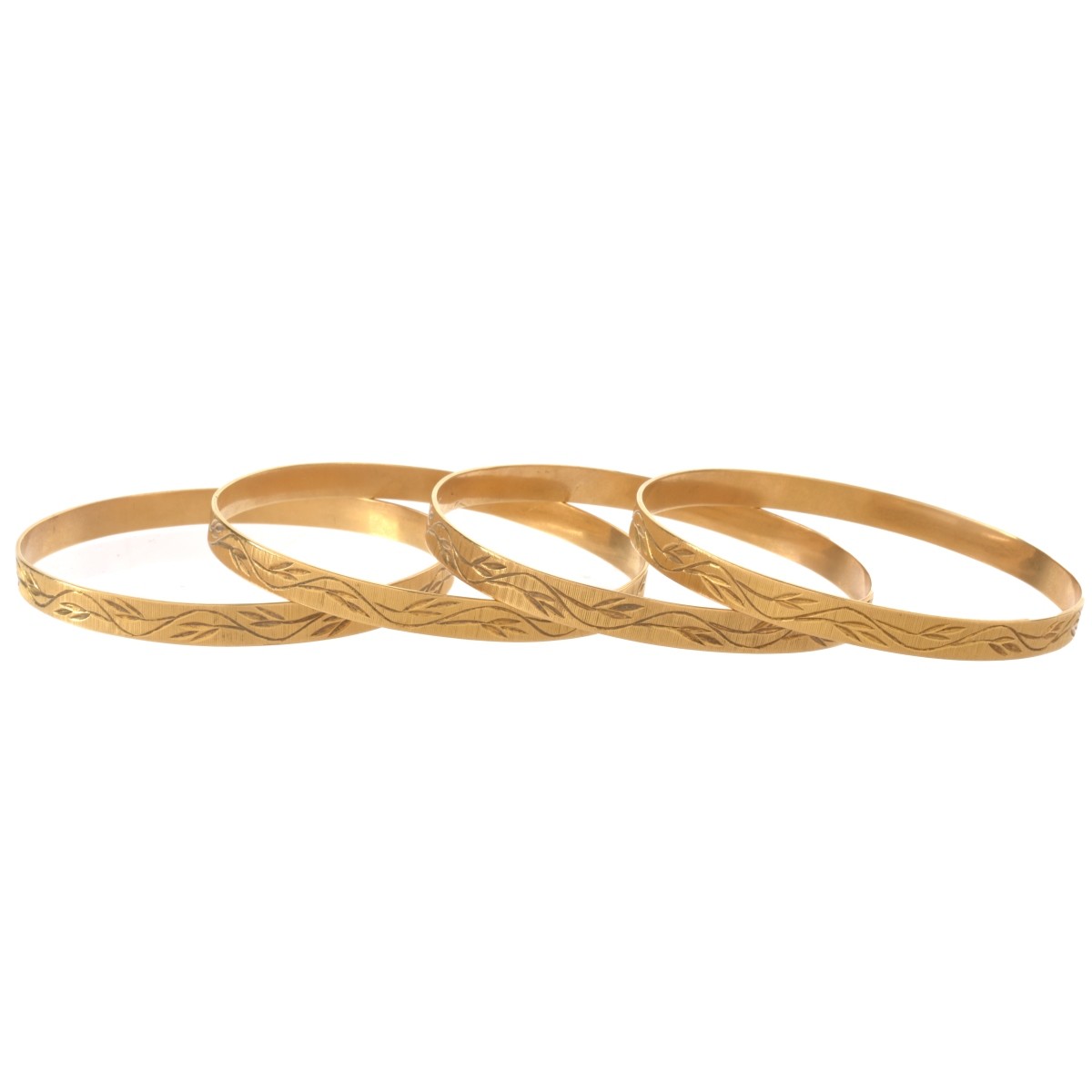 Four 18K Bangle Bracelets