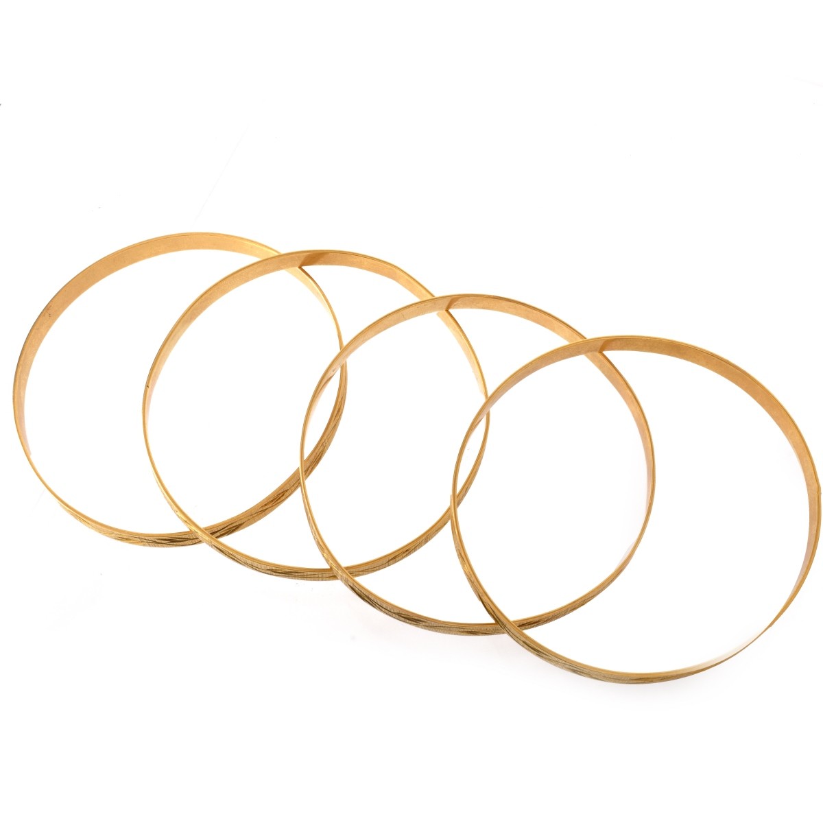 Four 18K Bangle Bracelets