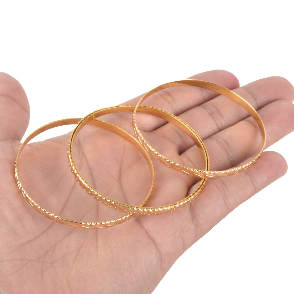 Four 18K (or higher) Bangle Bracelets