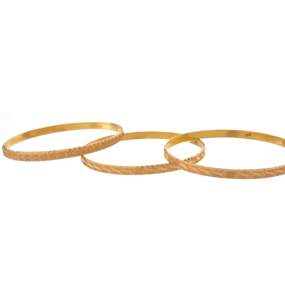 Four 18K (or higher) Bangle Bracelets